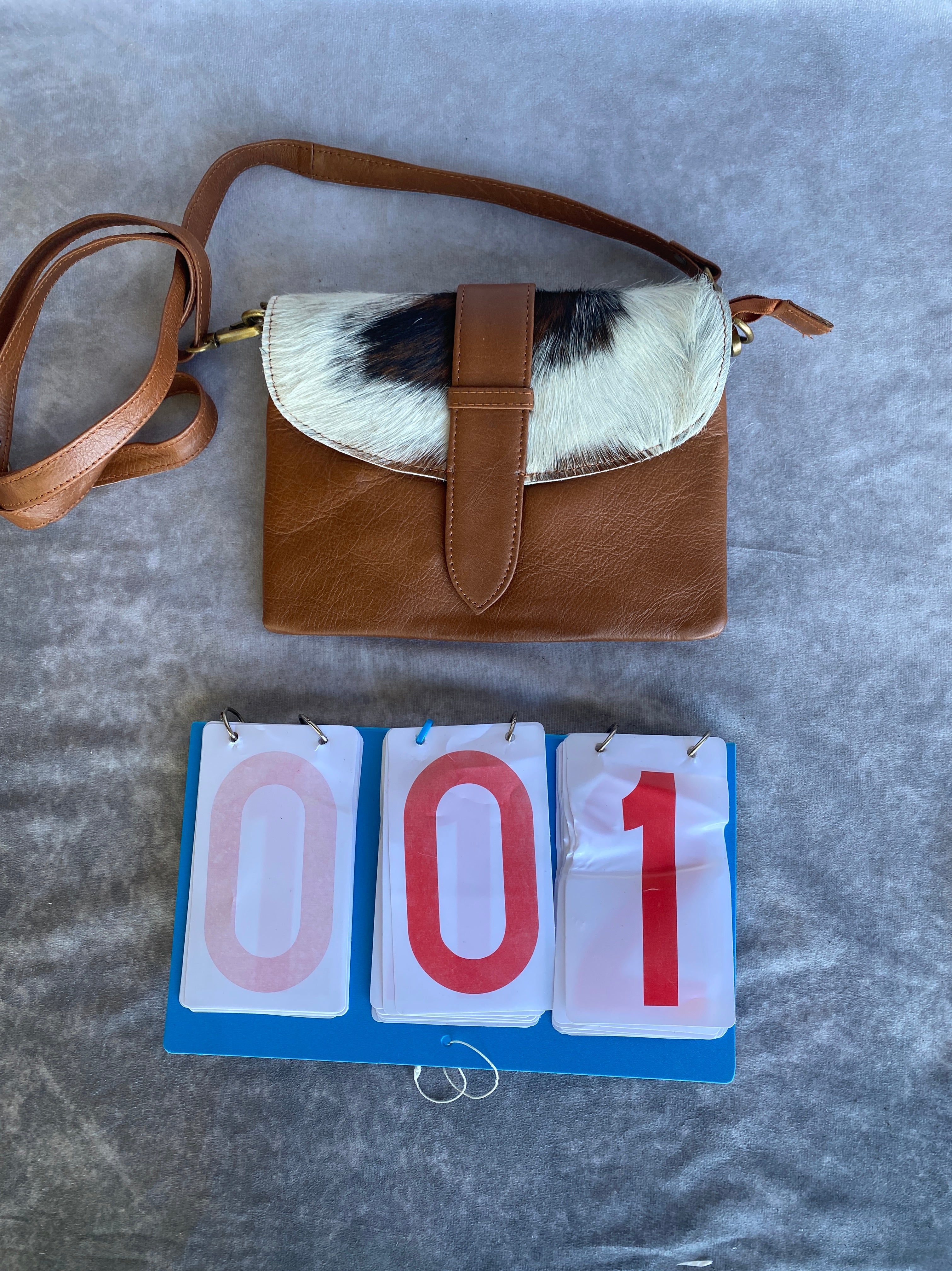 Cowhide Strap Clutch Bag