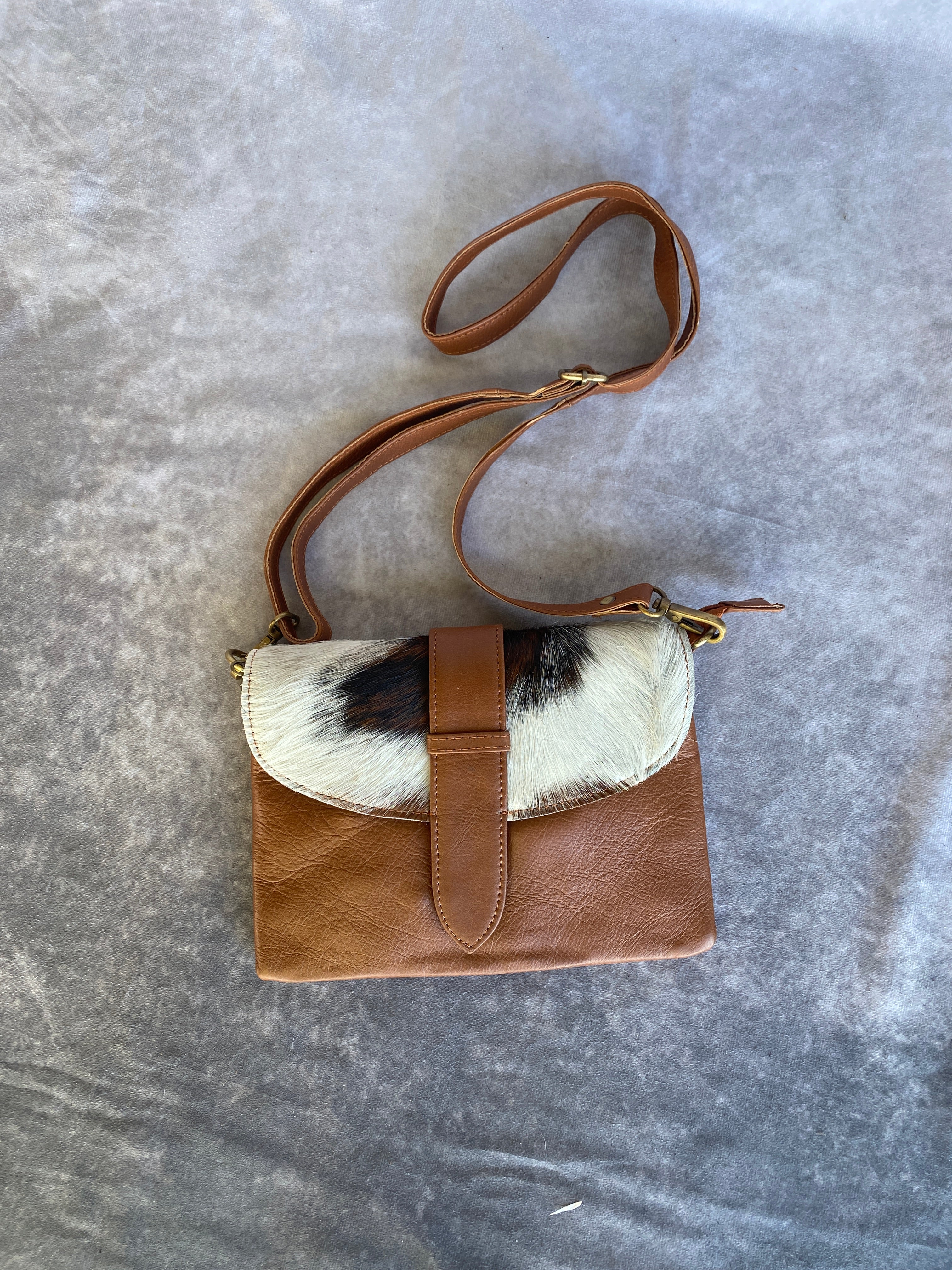 Cowhide Strap Clutch Bag