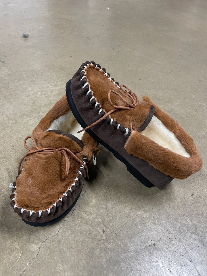 The Skin Thing HUGLIE Kangaroo Moccasins, brown suede and fur with white stitching and wool lining. Slip-on style.
