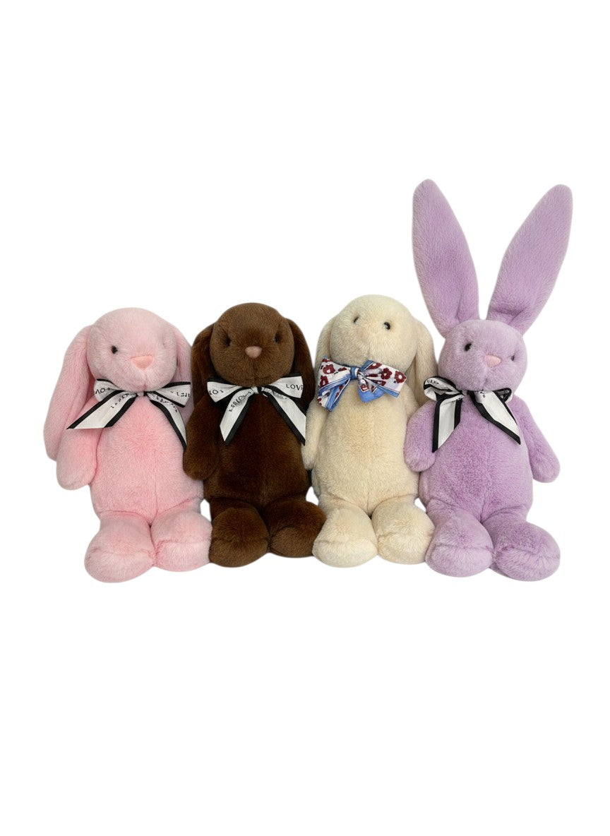 The Skin Thing Rex Rabbit plush toys in pink, brown, cream, and lavender, made from genuine Rex Rabbit fur.